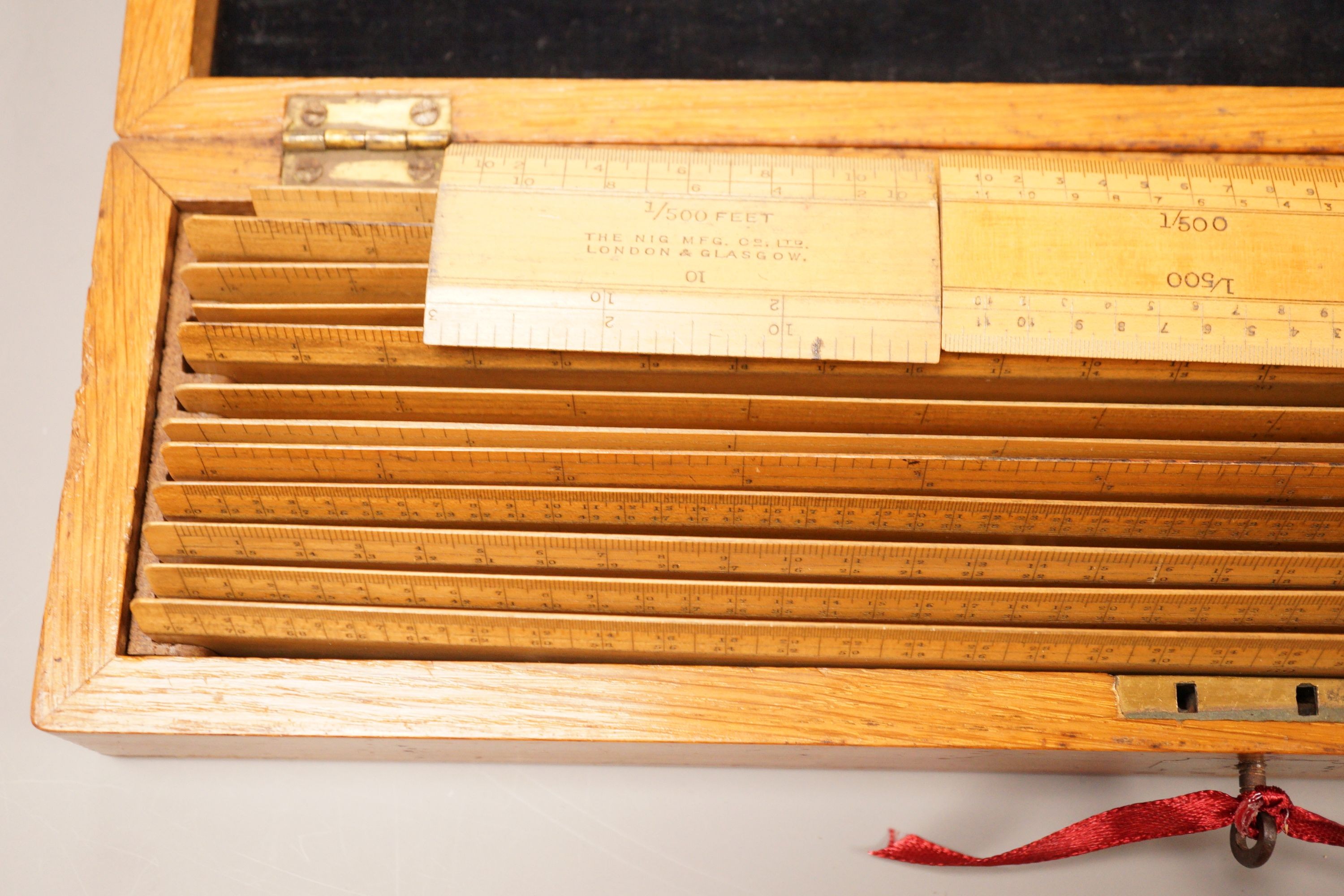 An oak cased set of draughtsman's rules